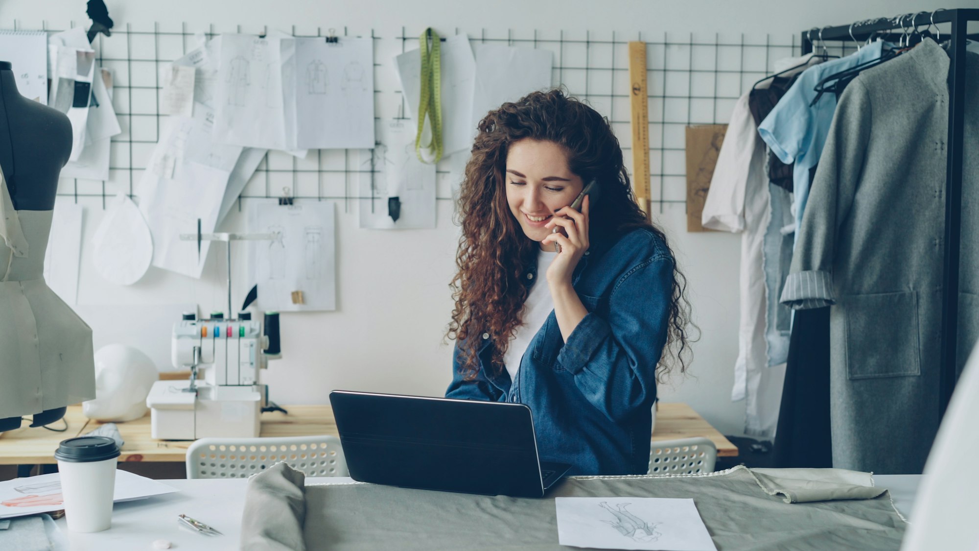 A remote professional on a phone call in her studio